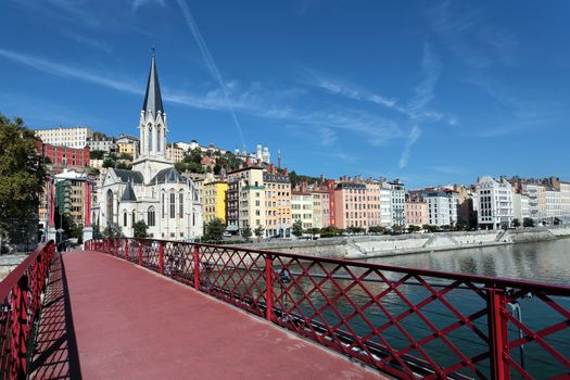 Lyon city with red footbridge on Saone river