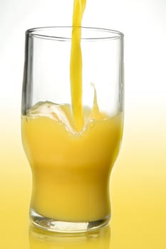 Pouring orange juice to a glass