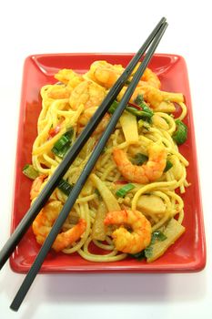 Pasta with asian shrimp in asian dishes