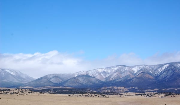 Rolling mountain hills with clouds