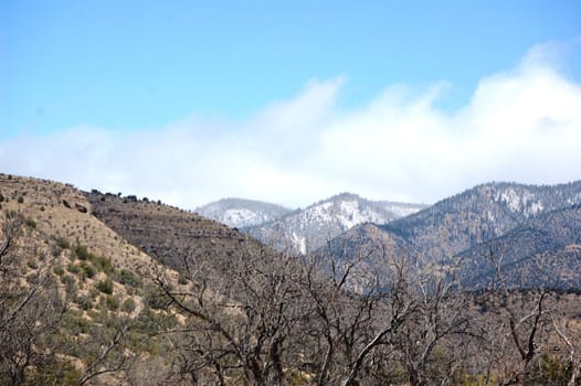 Rolling mountain hills with clouds