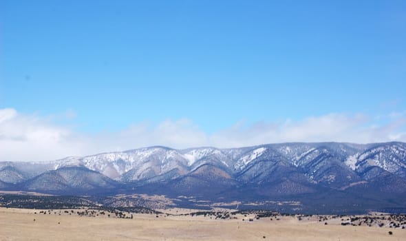 Rolling mountain hills with clouds