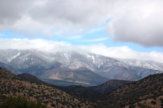 Rolling mountain hills with clouds