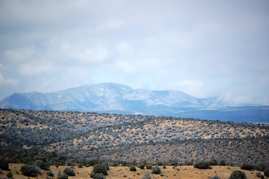 Rolling mountain hills with clouds