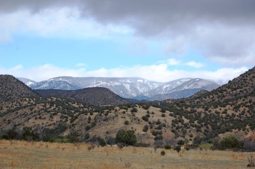 Rolling mountain hills with clouds