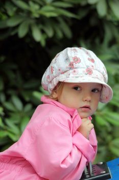 beautiful little girl at a excavators operating levers