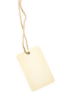 Hanging blank beige tag with cotton string over white background