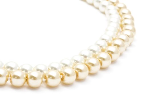Beautiful pearl necklace closeup on white background
