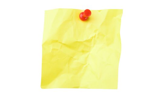 Yellow crushed sticky note attached with pushpin isolated on white background with clipping path