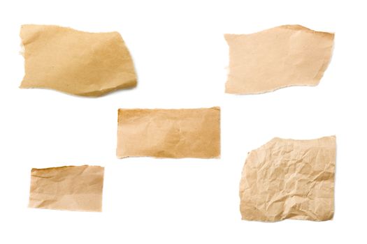 Pieces of brown packaging paper isolated on white background