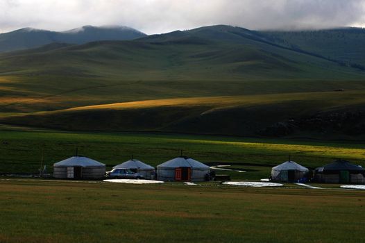 Landscape of gers at the foot of mountains in Mongolia