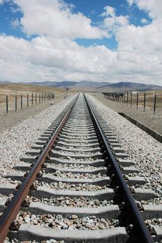 Railroad tracks extending to the distant in Tibet