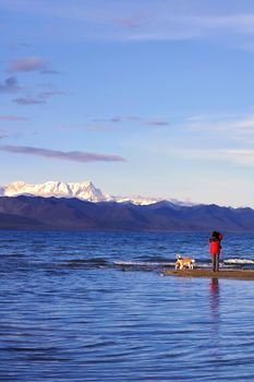 Landscape of blue lake and snow mountains in Tibet