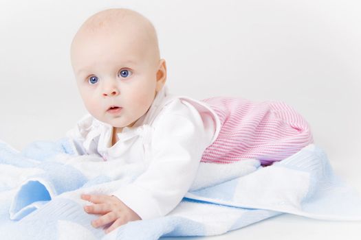 baby girl in the studio on the floor
