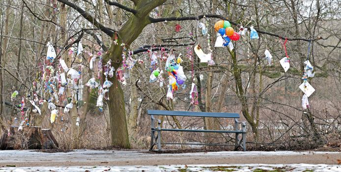 Tree with letters, toys and pacifiers for newborn babies