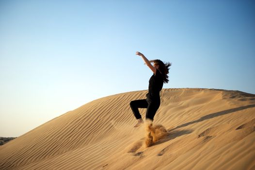 Woman enjoying the desert in Dubai, United Arab Emirates