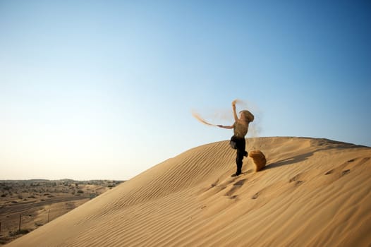 Woman enjoying the desert in Dubai, United Arab Emirates