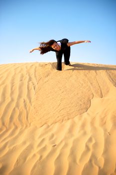 Woman enjoying the desert in Dubai, United Arab Emirates