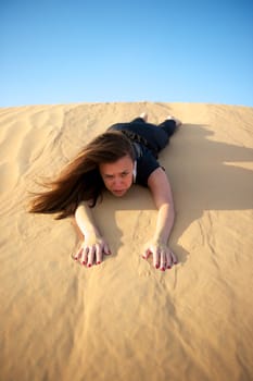 Woman enjoying the desert in Dubai, United Arab Emirates