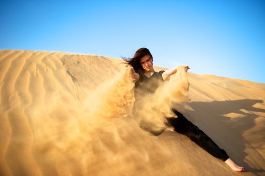 Woman enjoying the desert in Dubai, United Arab Emirates