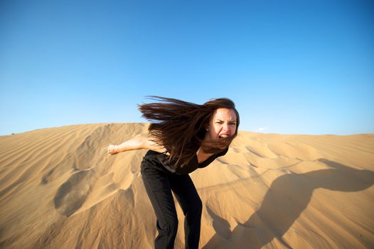 Woman enjoying the desert in Dubai, United Arab Emirates