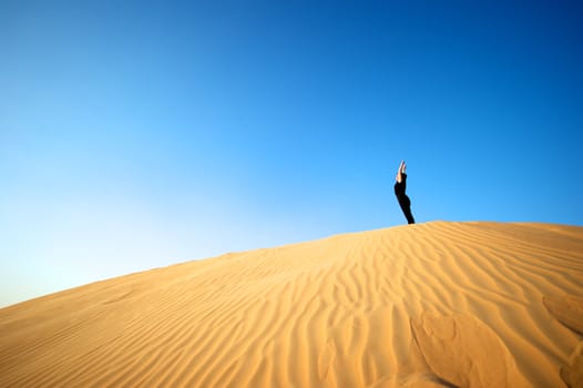 Woman enjoying the desert in Dubai, United Arab Emirates