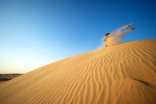 Woman enjoying the desert in Dubai, United Arab Emirates