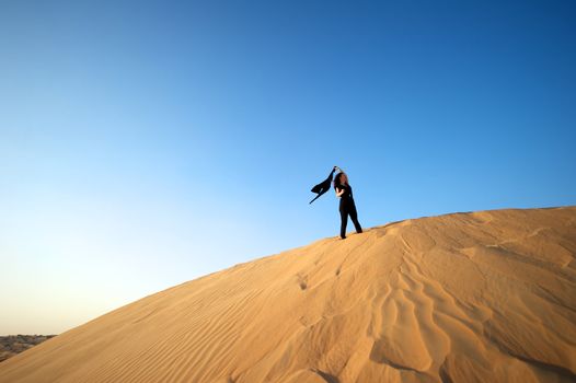 Woman enjoying the desert in Dubai, United Arab Emirates