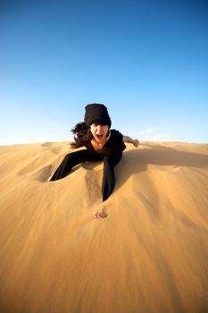 Woman enjoying the desert in Dubai, United Arab Emirates