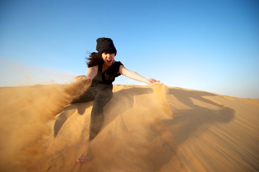 Woman enjoying the desert in Dubai, United Arab Emirates