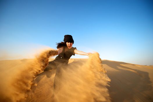 Woman enjoying the desert in Dubai, United Arab Emirates