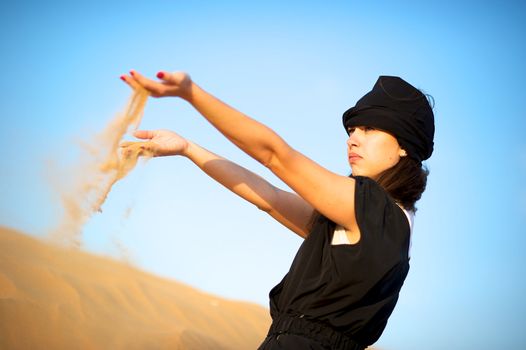 Woman enjoying the desert in Dubai, United Arab Emirates