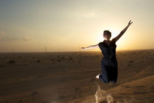 Woman enjoying the desert in Dubai, United Arab Emirates