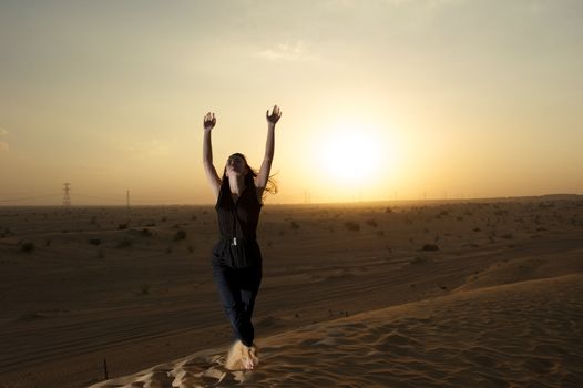 Woman enjoying the desert in Dubai, United Arab Emirates