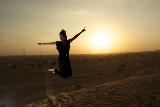 Woman enjoying the desert in Dubai, United Arab Emirates