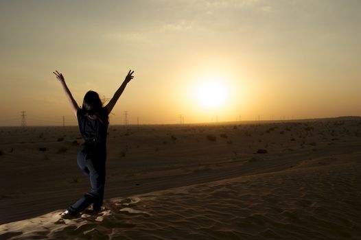 Woman enjoying the desert in Dubai, United Arab Emirates