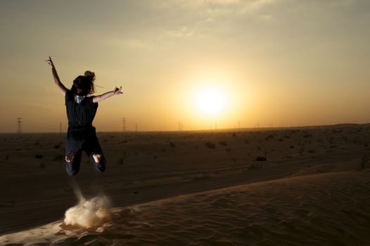 Woman enjoying the desert in Dubai, United Arab Emirates