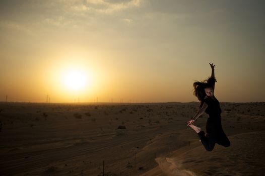 Woman enjoying the desert in Dubai, United Arab Emirates