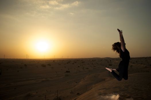 Woman enjoying the desert in Dubai, United Arab Emirates