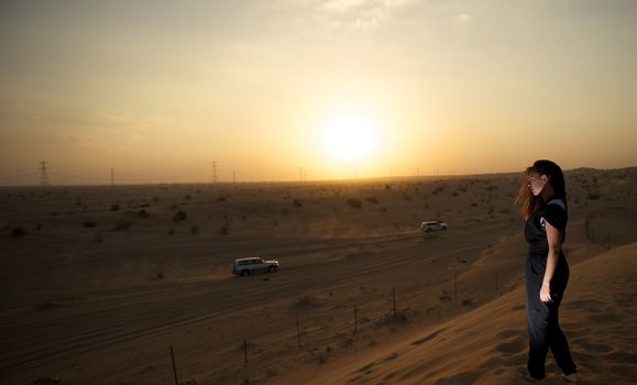 Woman enjoying the desert in Dubai, United Arab Emirates