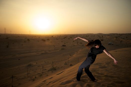 Woman enjoying the desert in Dubai, United Arab Emirates