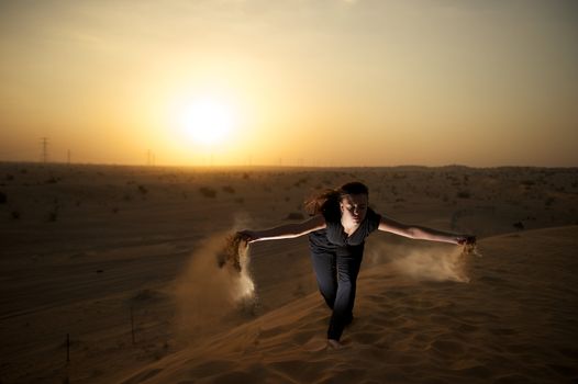 Woman enjoying the desert in Dubai, United Arab Emirates