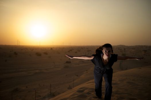 Woman enjoying the desert in Dubai, United Arab Emirates