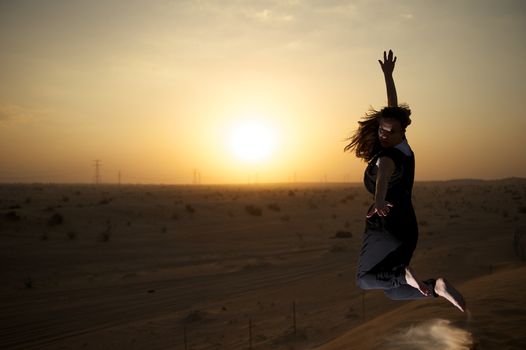 Woman enjoying the desert in Dubai, United Arab Emirates