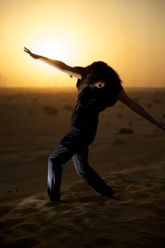 Woman enjoying the desert in Dubai, United Arab Emirates