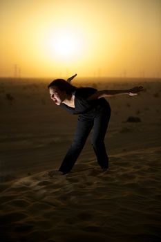 Woman enjoying the desert in Dubai, United Arab Emirates