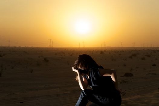 Woman enjoying the desert in Dubai, United Arab Emirates