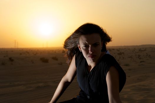 Woman enjoying the desert in Dubai, United Arab Emirates