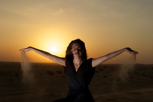 Woman enjoying the desert in Dubai, United Arab Emirates