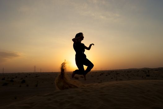 Woman enjoying the desert in Dubai, United Arab Emirates